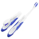 Folding Travel Toothbrush 2pk (Medium Bristle) - Assorted Red, Black & Blue – image 1